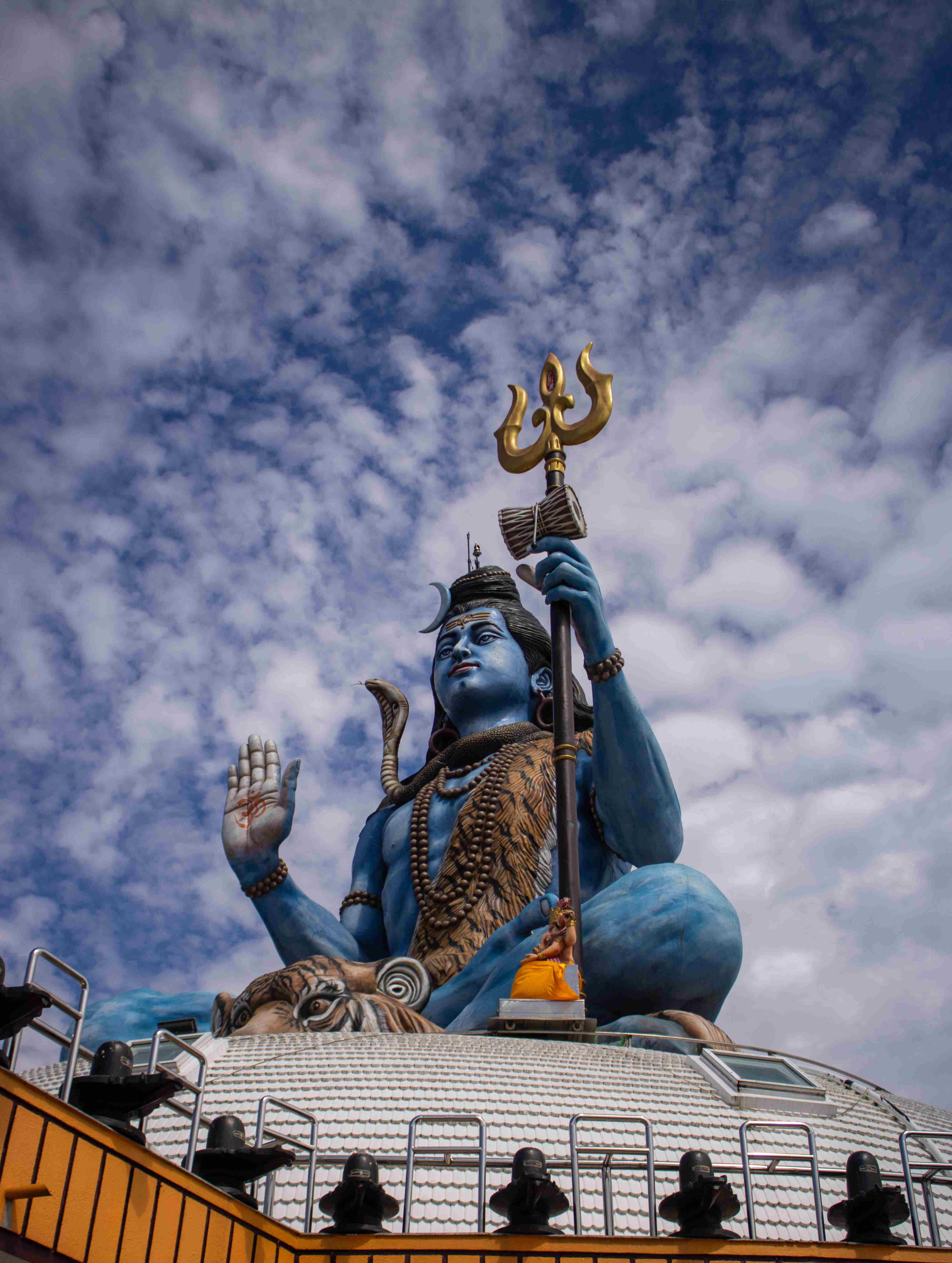 The grand Lord Shiva statue at Pumdikot, Pokhara, Nepal — a divine landmark overlooking the valley and mountains beneath open skies.