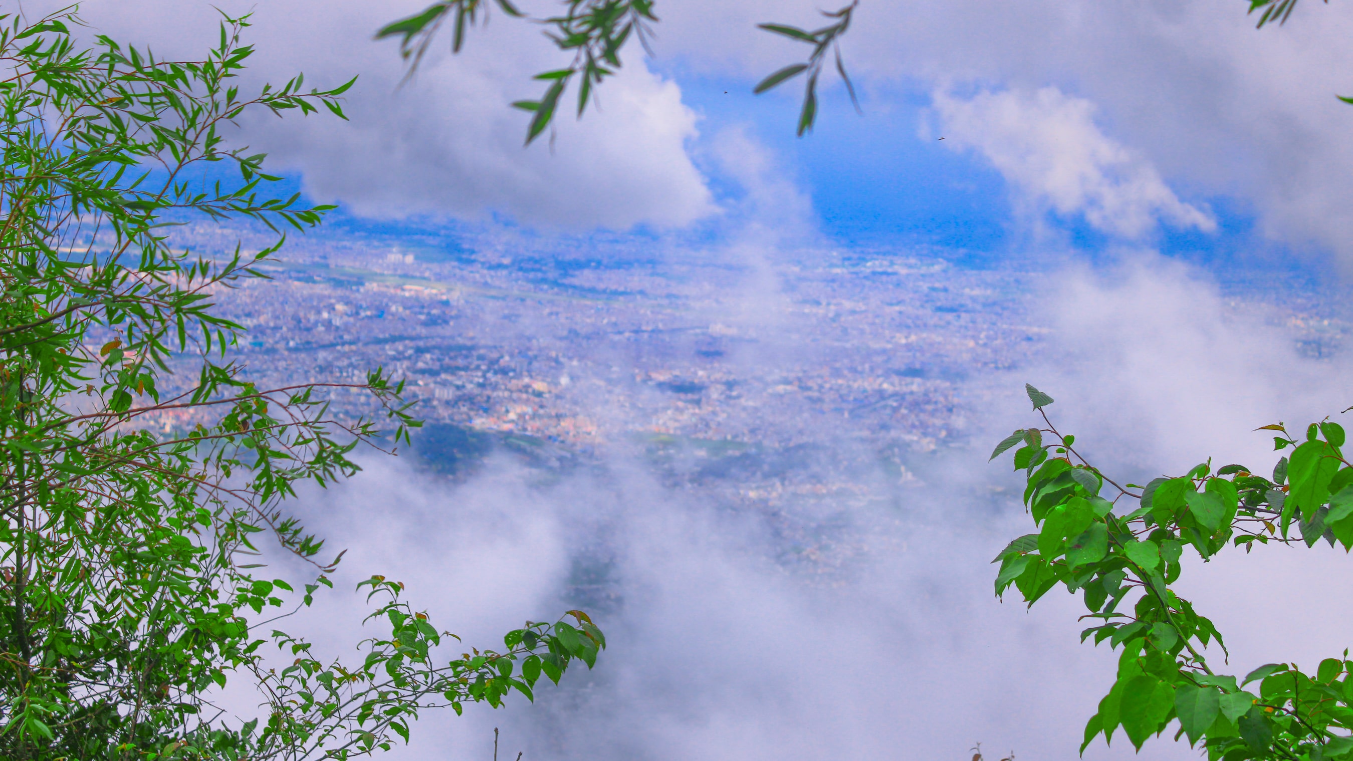 Mock of Laptop with wallpaper of A view kathmandu valley from top of Chandragiri Hill 